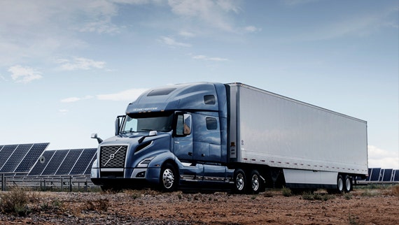 Technicians reviewing truck systems